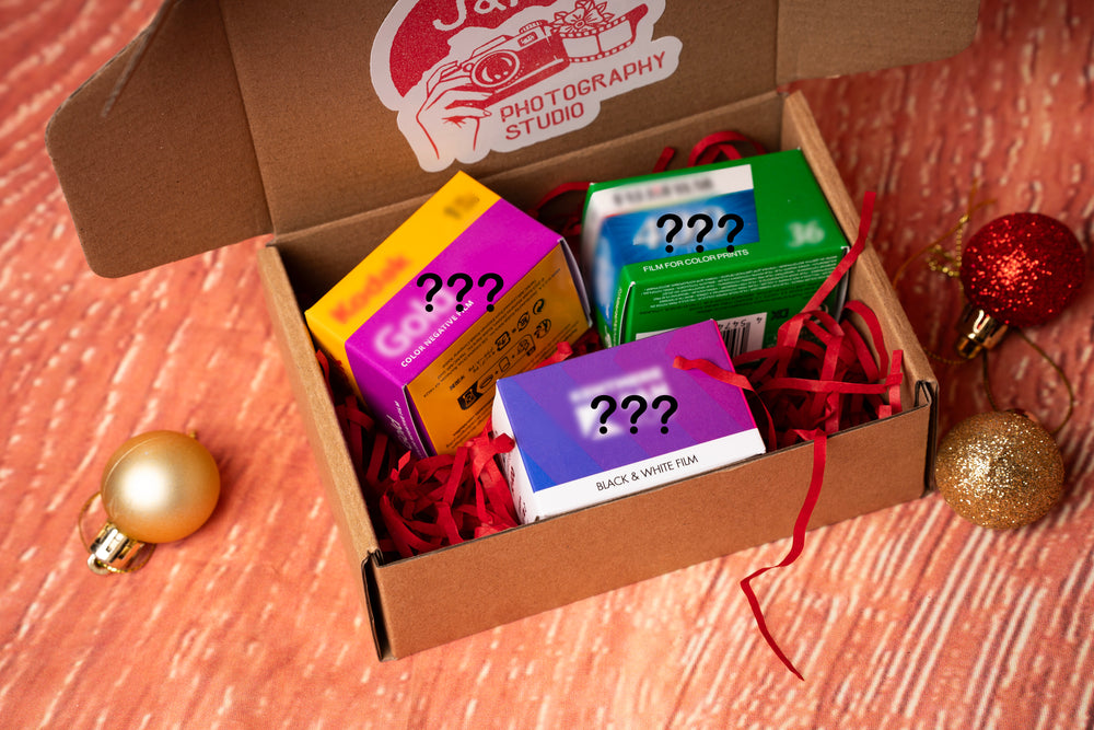 Christmas gift box opend showing the lucky dip film - J&A Photography Studio