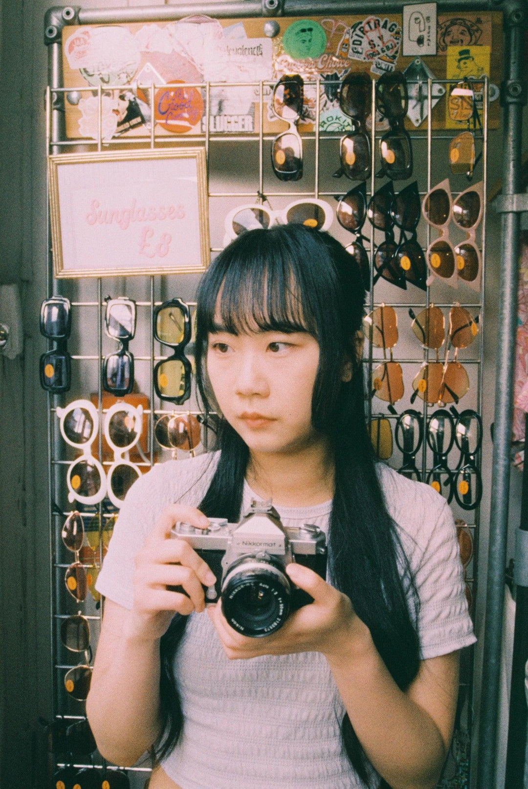 Portrait photograph shot on Ilford Harman Phoenix 200 II 35mm film showing warm reds and purples