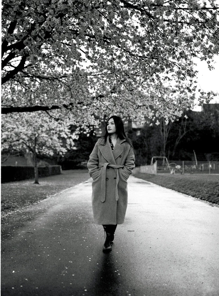 Outdoor portrait captured on HP5 120 roll film highlighting authentic monochrome textures and contrast