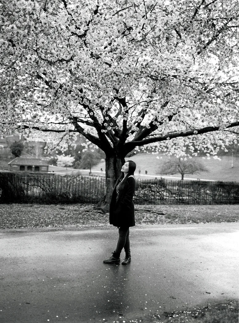 Outdoor portrait taken on Ilford HP5 Plus 400 120 film with natural light and expressive black and white tones