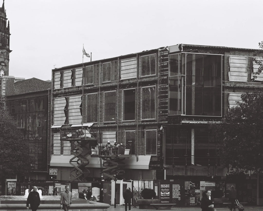 Urban scene photographed using Kentmere 100 120 roll film, showcasing rich monochrome contrast and textures