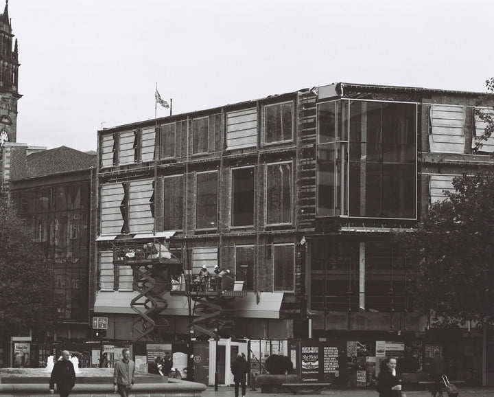 Urban scene photographed using Kentmere 100 120 roll film, showcasing rich monochrome contrast and textures