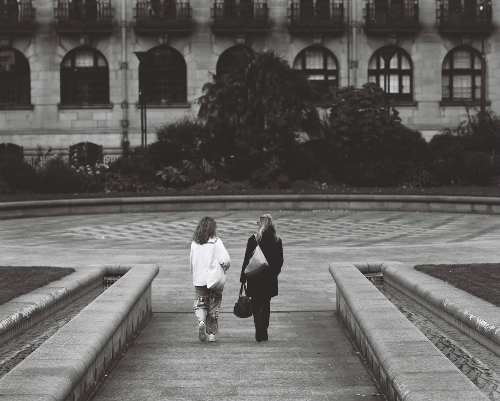 Street and city life shot on Kentmere Pan 100 120 film, highlighting sharp details and expressive black and white tones