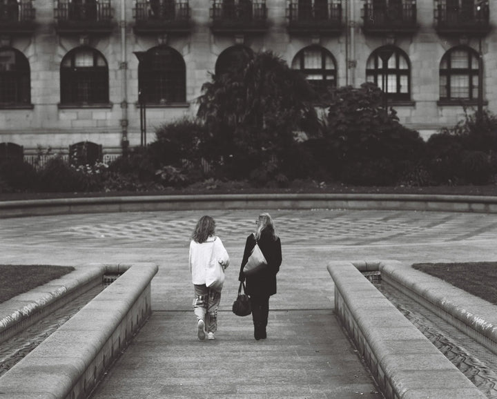 Street and city life shot on Kentmere Pan 100 120 film, highlighting sharp details and expressive black and white tones