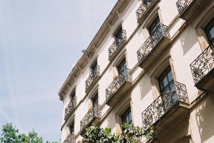 Urban skyline photographed using Lomo100 colour negative film, highlighting crisp textures and realistic tones