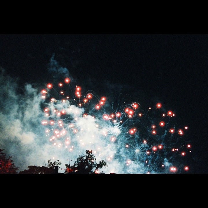Nighttime fireworks photographed using Lomography 800 35mm film, showcasing rich tones and cinematic analogue quality