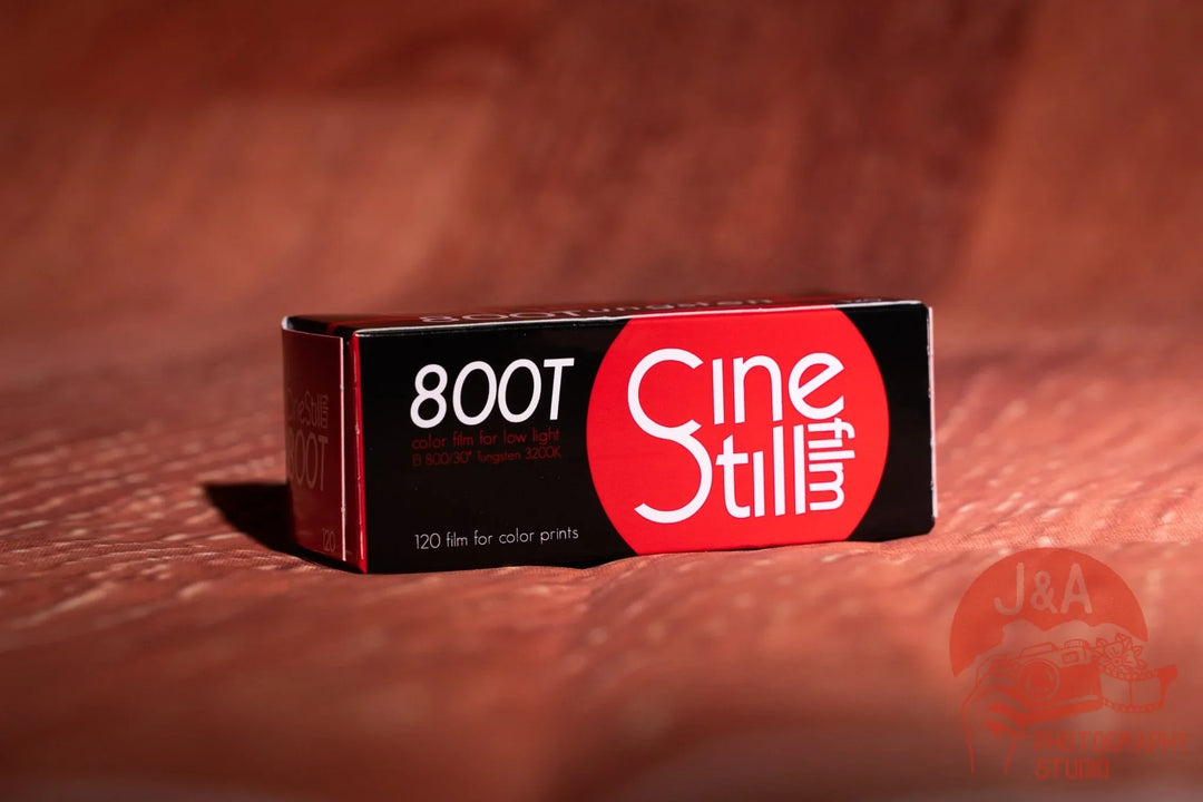 High-quality product image of Cinestill 800T 120 film roll, medium-format tungsten-balanced film ideal for low-light, cinematic colour photography.