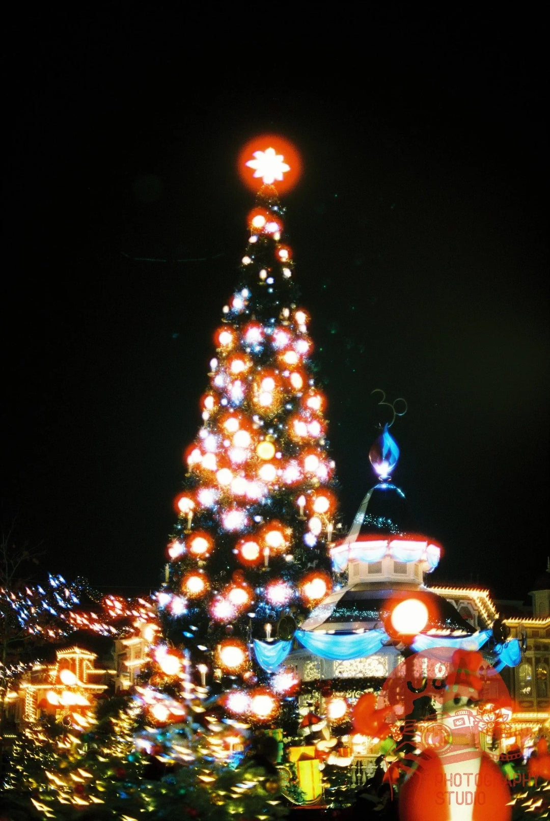 City street at night captured on Cinestill 800T 35mm film, showcasing cinematic tungsten tones