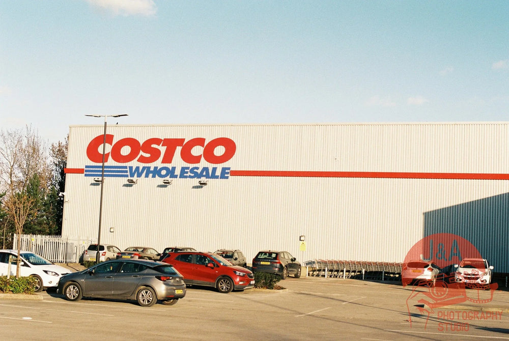 Sunset scene outside Costco captured on Fujifilm 400 35mm film, showing vibrant colours, fine detail, and natural lighting.