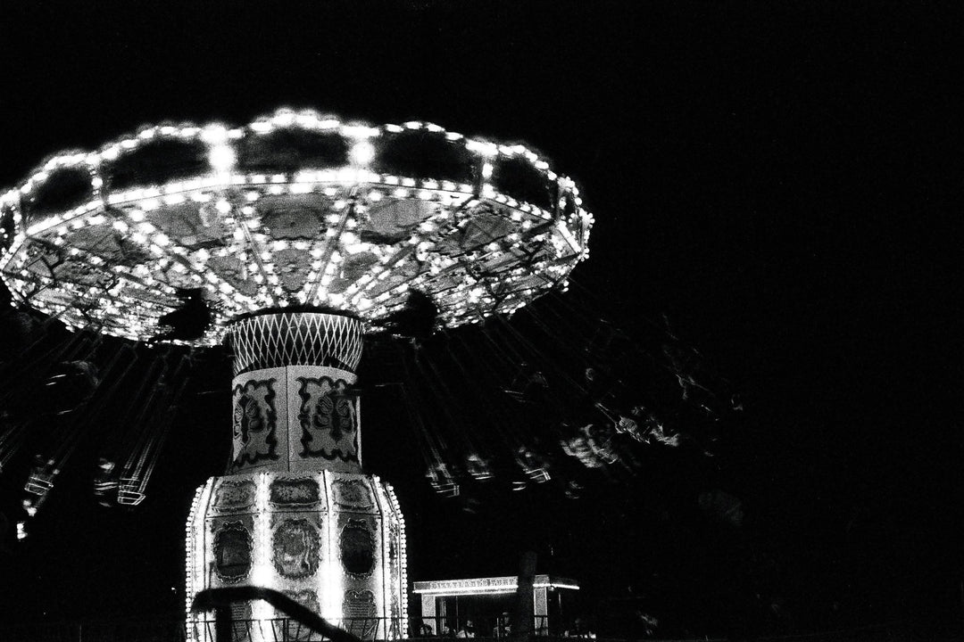 Festive decorations at a Christmas market on Ilford Delta 3200 35mm film, highlighting moody atmosphere and detailed tonal range.
