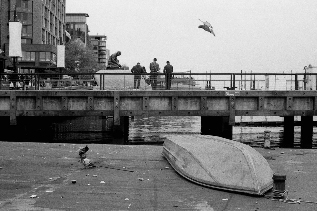 Rear view of a boat captured on Ilford HP5 Plus 400 35mm film, featuring fine grain, rich black and white tones, and detailed textures.