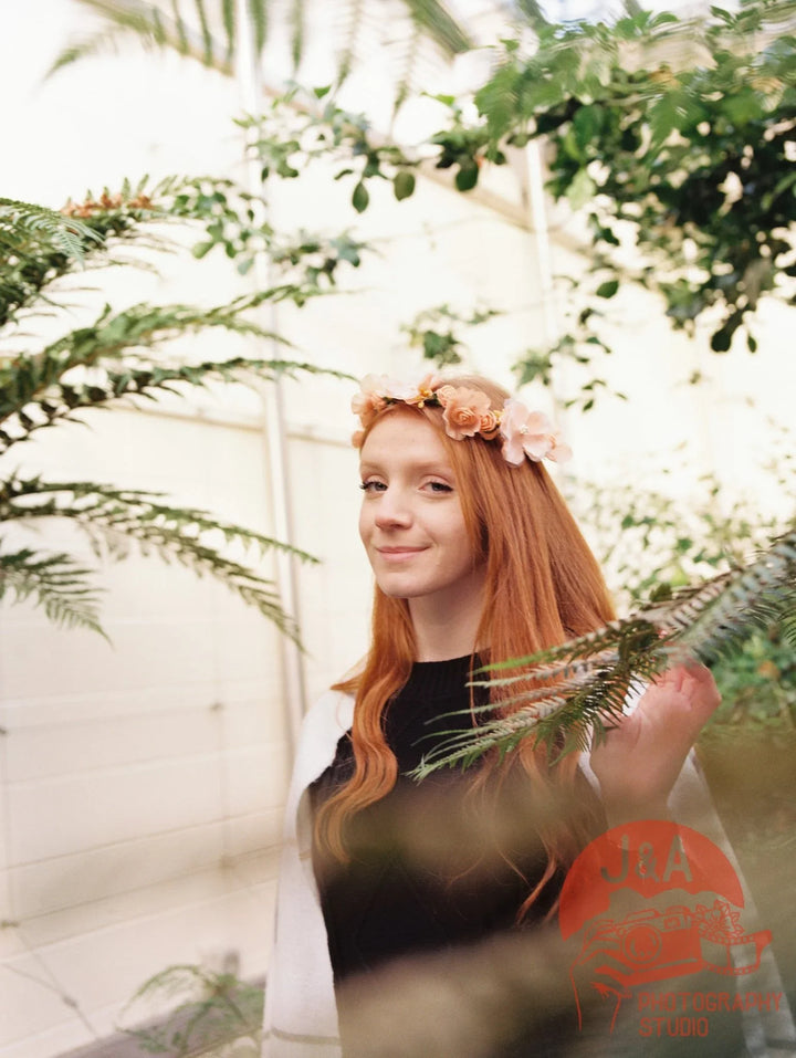 Girl walking through Sheffield Botanical Gardens photographed on Kodak Gold 200 film, highlighting lush greenery and warm, vivid tones