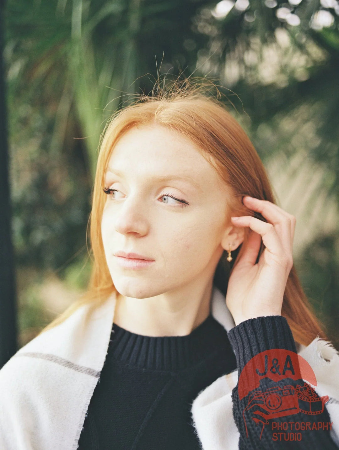 Portrait of a girl in Sheffield Botanical Gardens captured on Kodak Gold 200 120 film, showing natural skin tones and vibrant colours.
