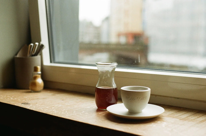 View from a riverside cafe photographed on Kodak Gold 200 35mm film, highlighting warm tones, rich colours, and atmospheric lighting.