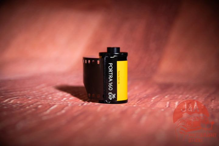 High-quality product photo of Kodak Portra 160 35mm film roll, professional colour negative film ideal for portraits, fine grain, and natural skin tones, 1 roll
