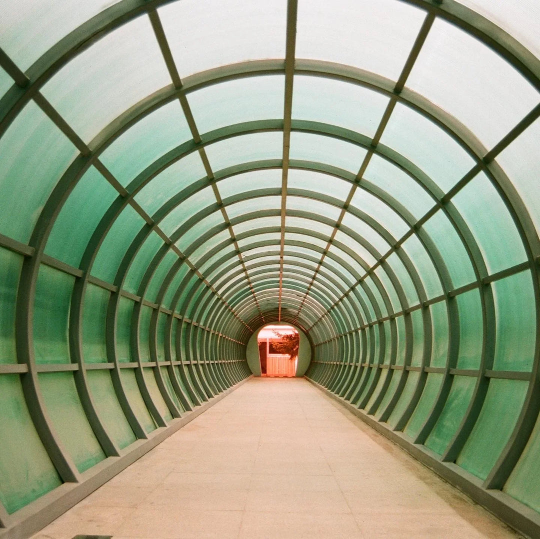 Underwater tunnel at an aquarium shot on Kodak Professional Portra 400 film, showing vivid hues, balanced contrast, and excellent low-light performance.