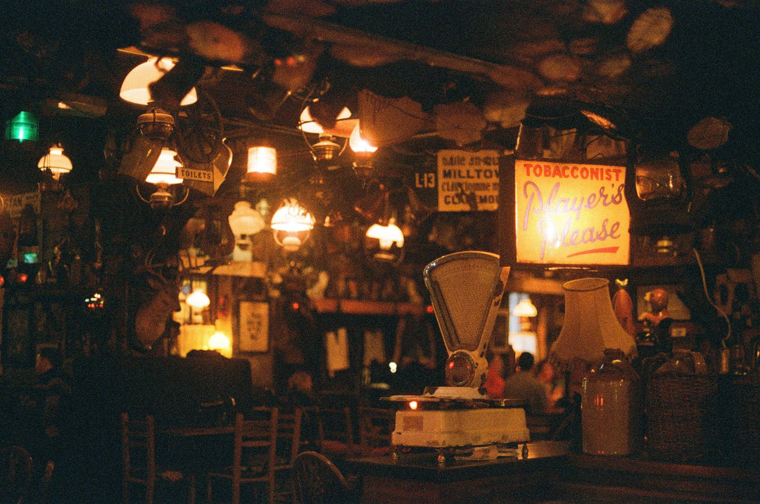 Interior of an old bar shot on Kodak Portra 800 35mm film with warm lighting and rich vintage atmosphere.